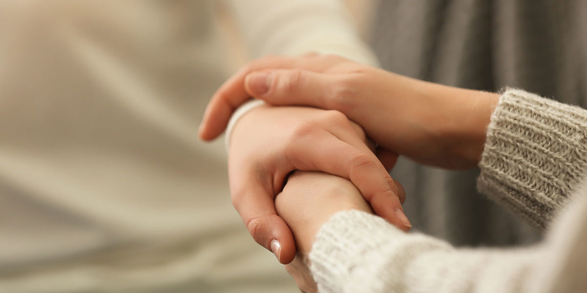 a woman talking to her friend about heroin addiction treatment