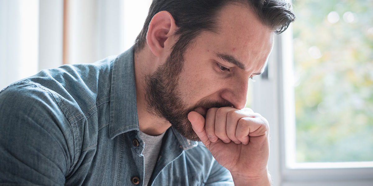 a man feeling upset as his friend goes through heroin withdrawal