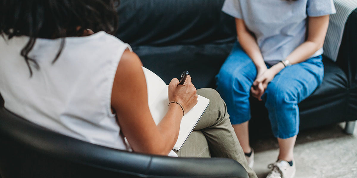 therapist talking to patient during addiction therapy