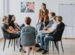 a group of people in an alcohol detox program talking about what qualities make it successful