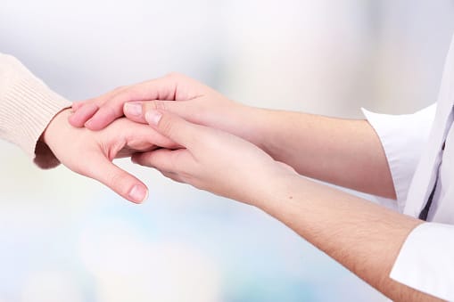 Holding h ands for support during a holistic detox program