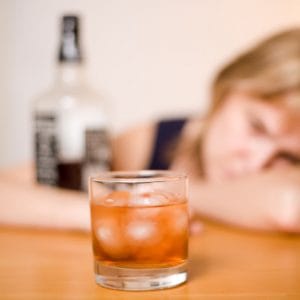 Her depression is a symptom of addiction to alcohol.