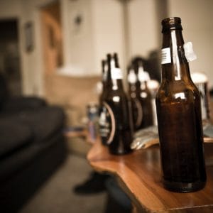 Binge drinking involves lots of alcohol at one sitting-like these beer bottles all lined up.