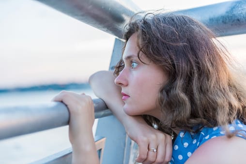 Alcohol addiction for this woman looking over the water feels like drowning.