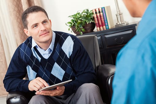 Male Counselor explaining dialectical behavior therapy DBT in session