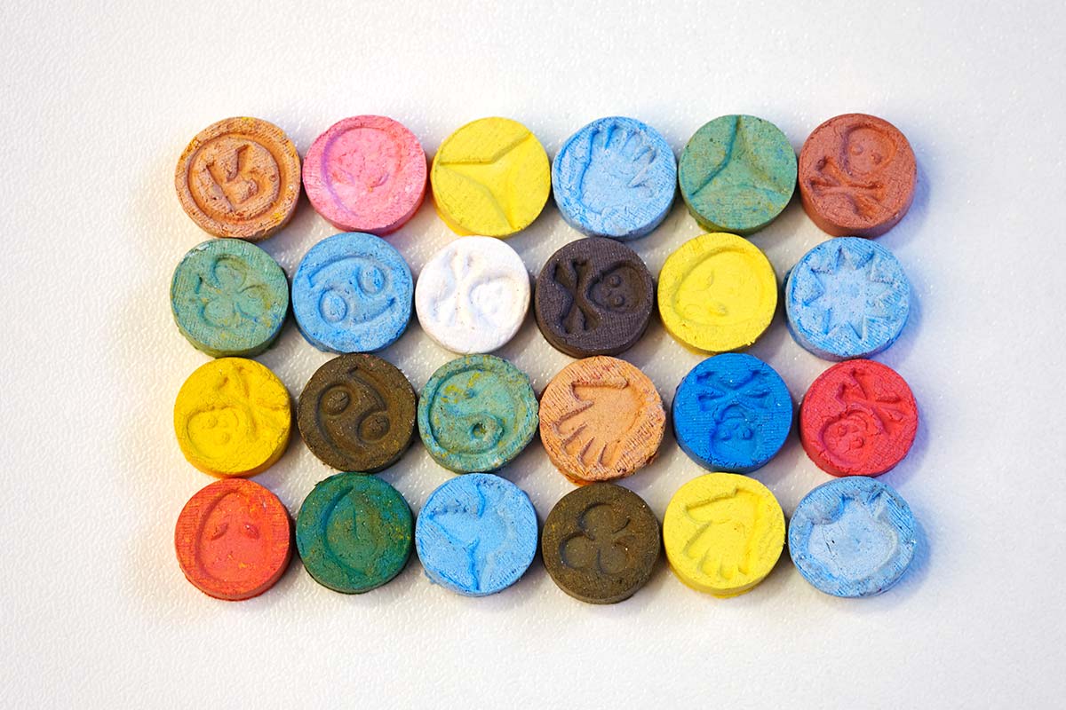 organized rows of multicolored ecstasy pills not allowed during ecstasy detox in florida