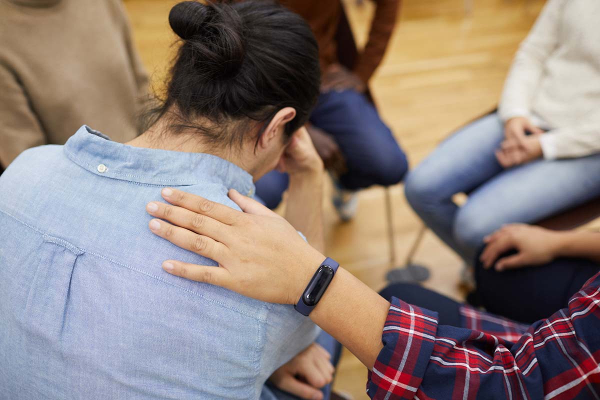 person being comforted in the group circle at the detox center in florida