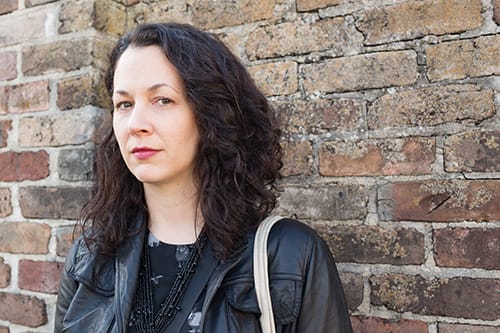 Woman against wall looking for a center that provides benzodiazepine detox.