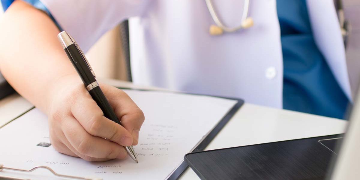 what-is-cirrhosis close up of doctor writing a note for a patient explaining, what is cirrhosis