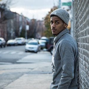 Young man on the street is not quite sure when to detox from his addiction.