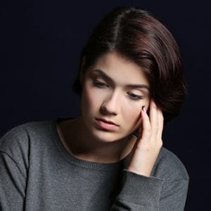 Oxycodone addiction has this woman in gray worried.