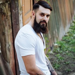 Bearded man against fence looking for marijuana detox center ft lauderdale