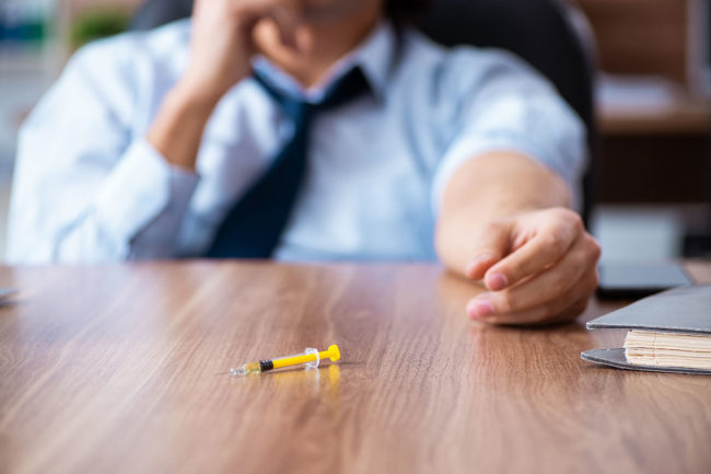 a person dealing with substance abuse in the workplace