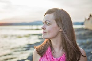 Satisfied looking woman on beach at drug detox center in Florida
