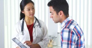 Medical staff talking to patient about drug detox programs