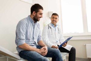 Doctor suggesting to cheerful patient a Florida alcohol detox center