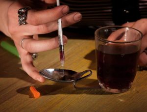 what is black tar heroin this Picture of someone getting ready to shoot it tells the story