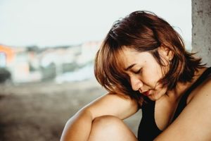 Depressed young woman understands the chemical dependency definition