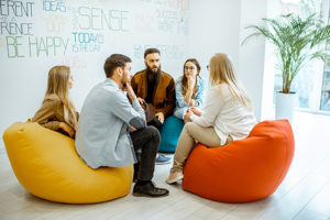 a group of people discussing health and wellness program
