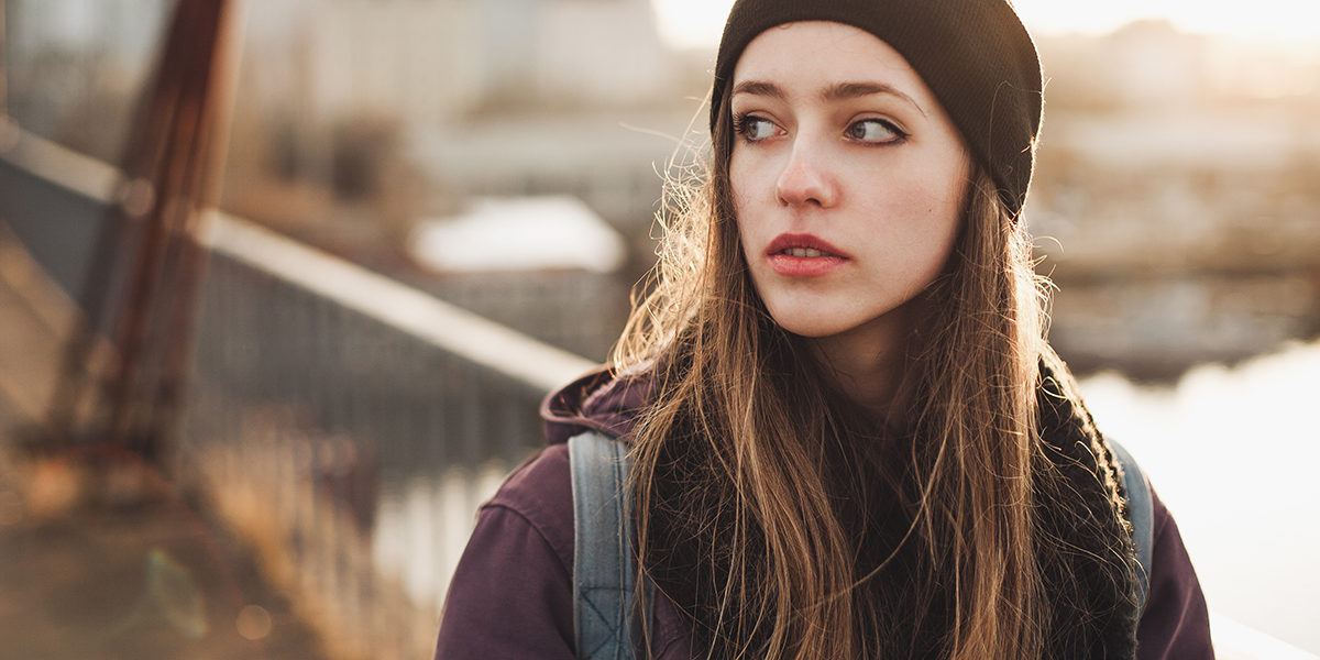 a young woman on a bridge wondering what are bath salts