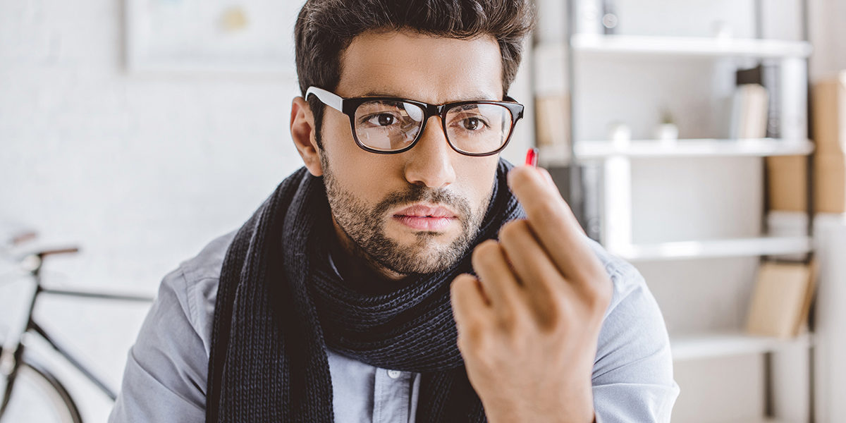 a man looking at his medicine after learning about suboxone side effects