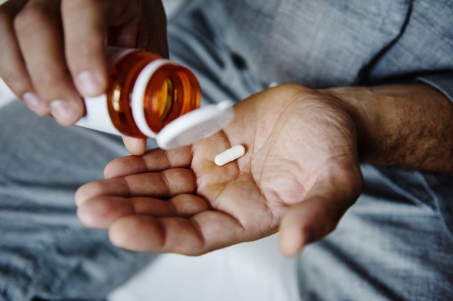 most-abused-prescription-drugs man holding one of the most abused prescription drugs
