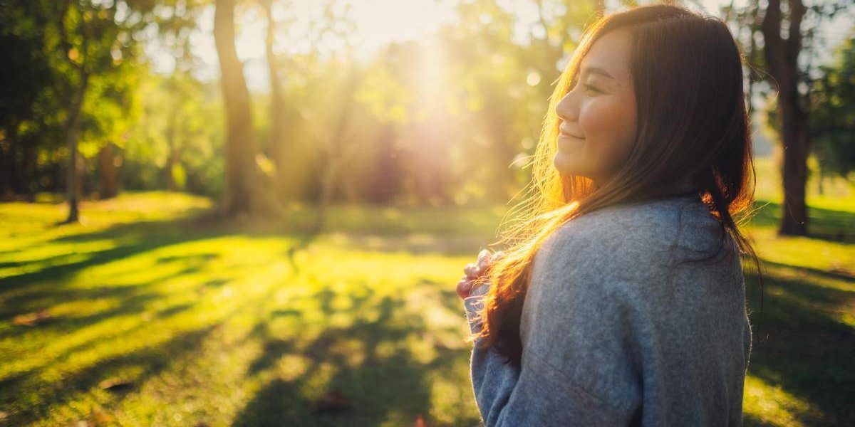 Healing from Addiction woman walking through sunshine healing from addiction