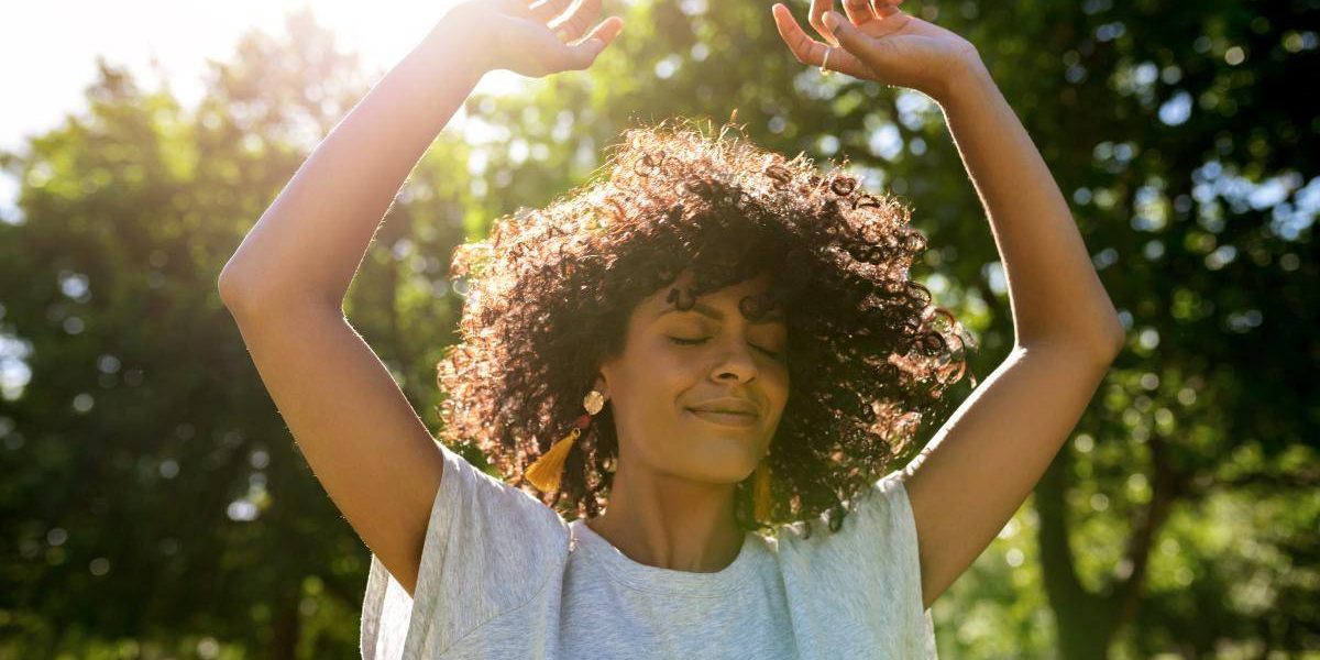 woman with arms up in the sun at florida drug detox