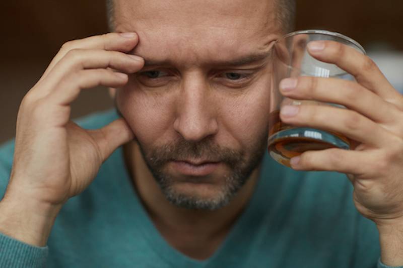 a man is considering quitting drinking