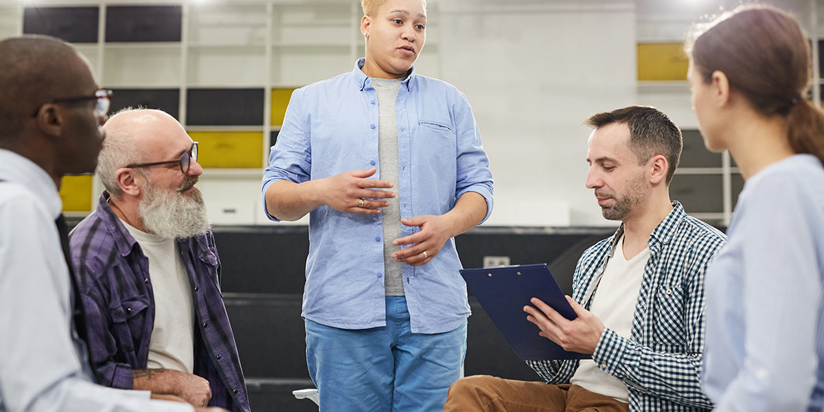 a group therapy session discussing alcohol addiction recovery