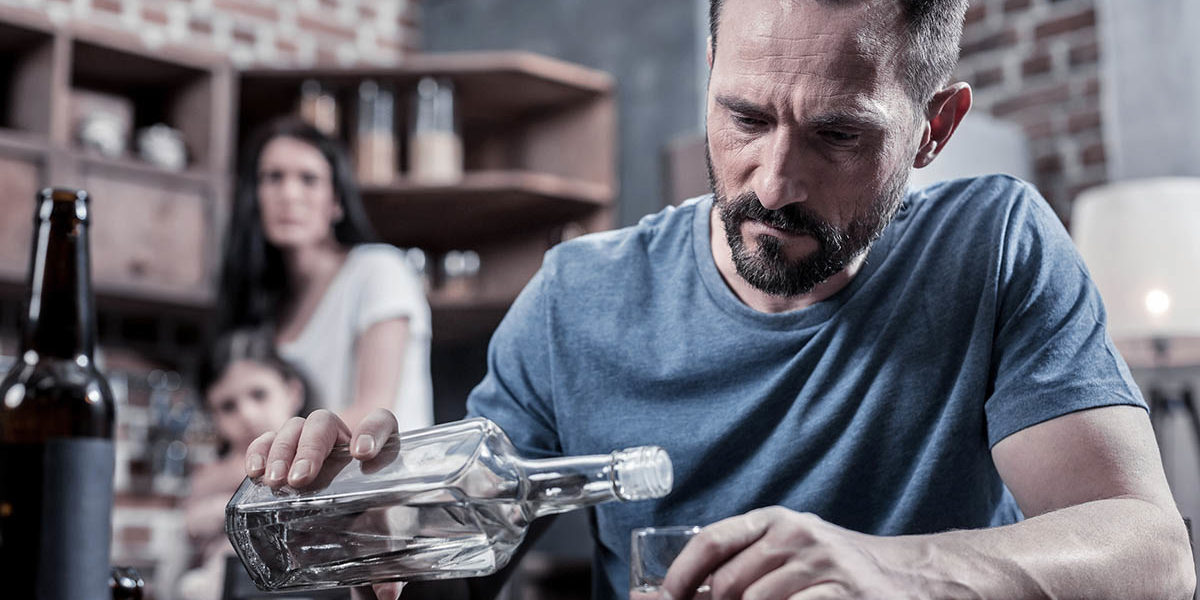 a man drinking alcohol without knowing how addiction affects families