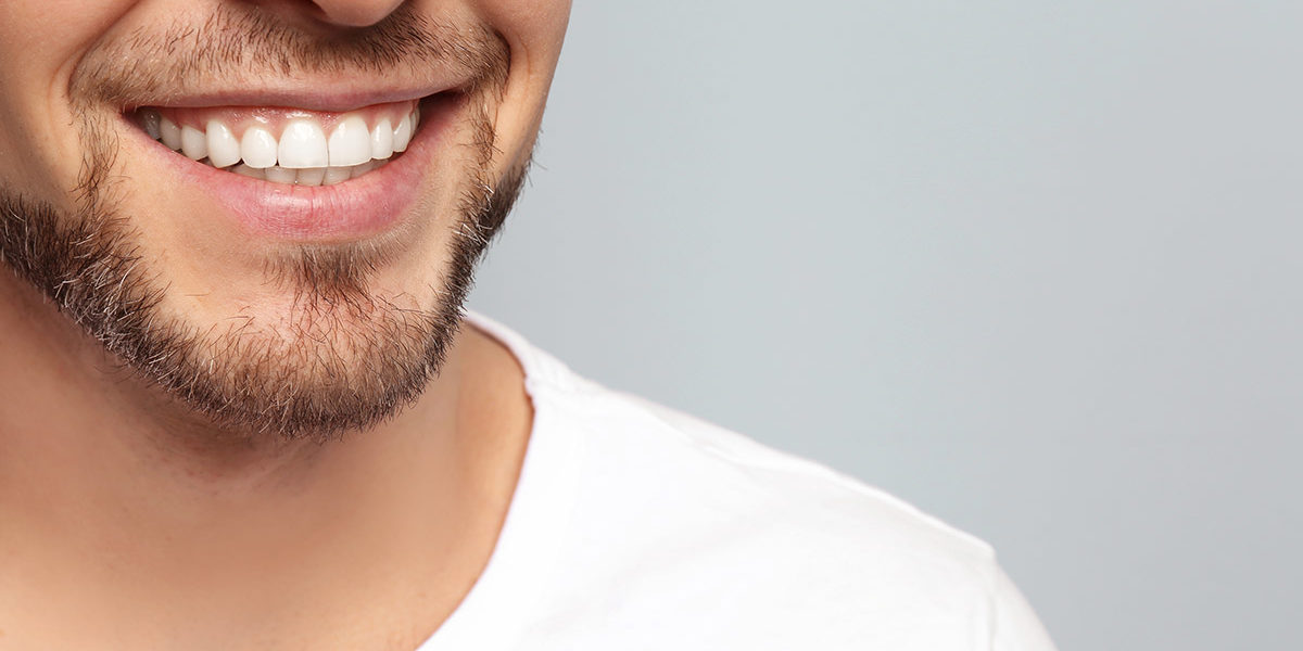 a man smiling because he did not experience the meth effects on teeth