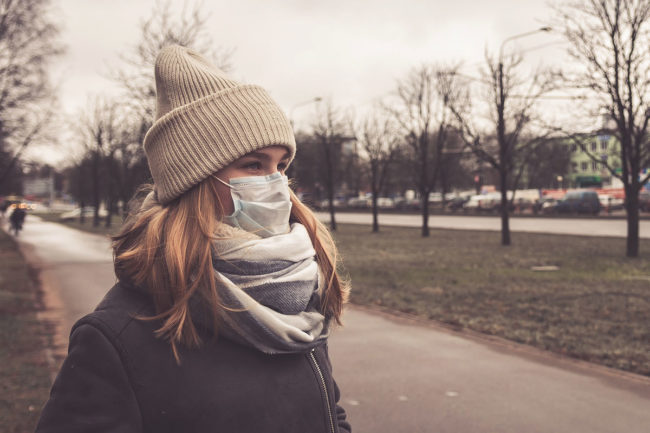 a woman wearing a mask after learning about addiction and your physical health