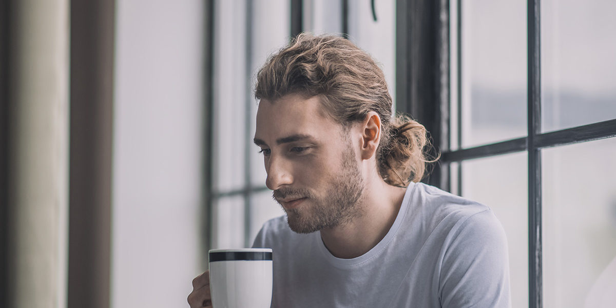 a man drinking a coffee thinking about Detox In Pittsburgh