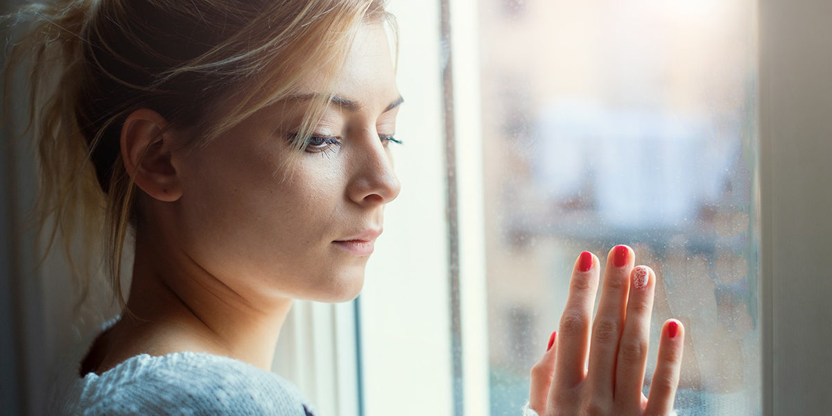 a woman with a drug addiction in Tennessee looking out the window