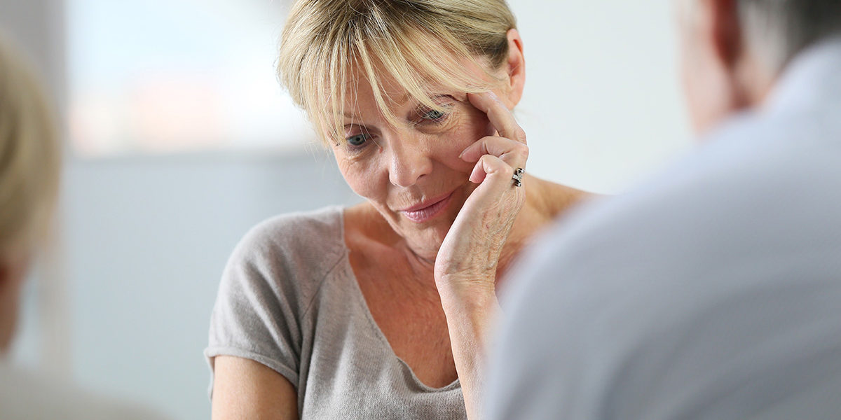 a woman crying during group therapy at a Delaware drug and alcohol detox