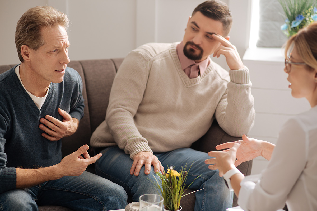 two men discussing the problems in detox center in Doral