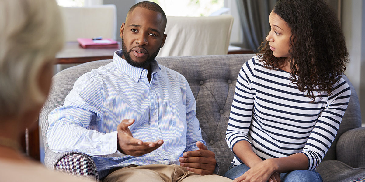 a man talking to a doctor and wife about rehab center in Illinois