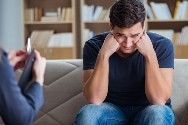 a man upset in therapy at a drug rehab Oregon