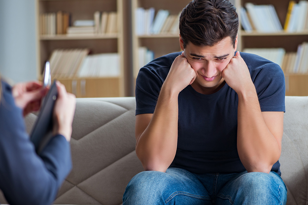 a man upset in therapy at a drug rehab Oregon
