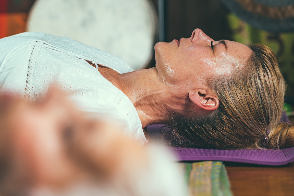 a woman meditating wondering how to find a detox facility