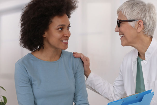 a woman talking to a doctor about Idaho drug detox center