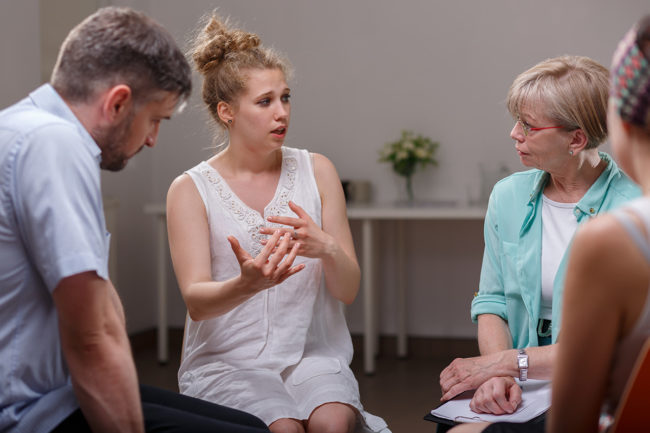 a woman talking about her experience at a Kansas Drug Detox