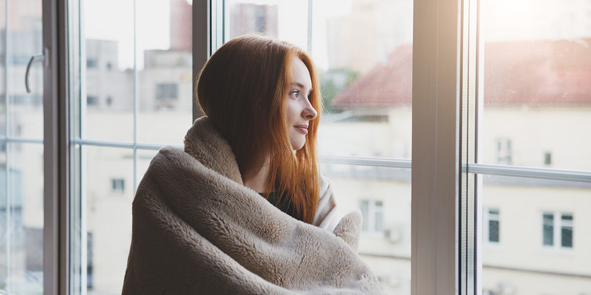 a woman looking out the window of a Nevada drug detox center