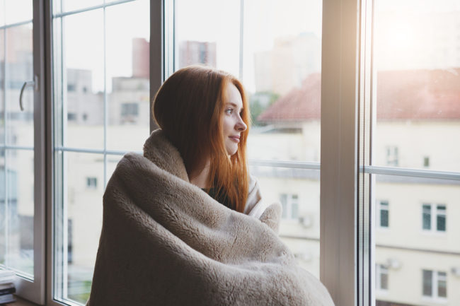 a woman looking out the window of a Nevada drug detox center