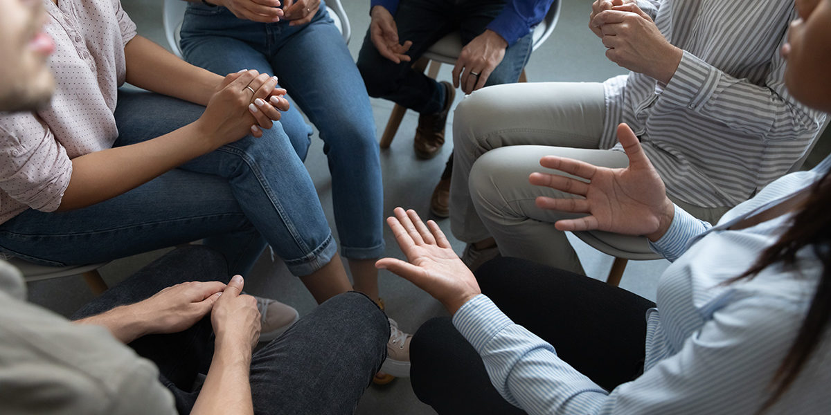 a group therapy session talking about Virginia drug detox