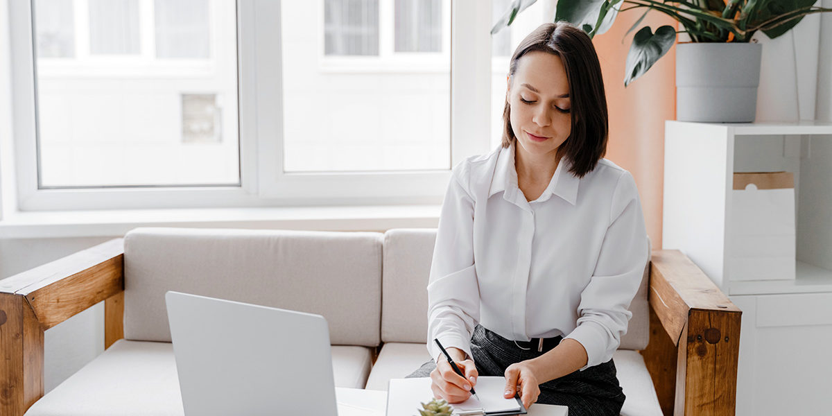 woman sitting and writing Wisconsin Detox