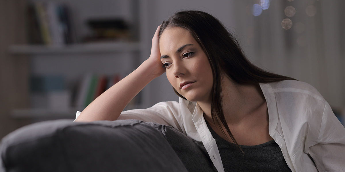 a woman thinking about the differences between physical dependence vs addiction