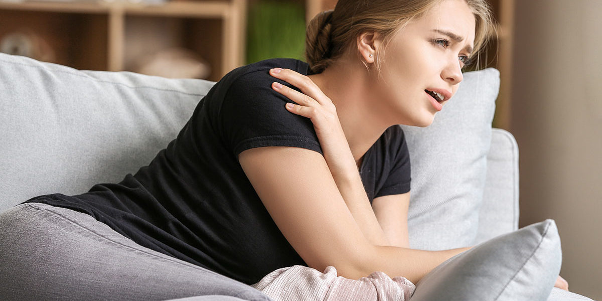 a woman showing signs of a panic attack