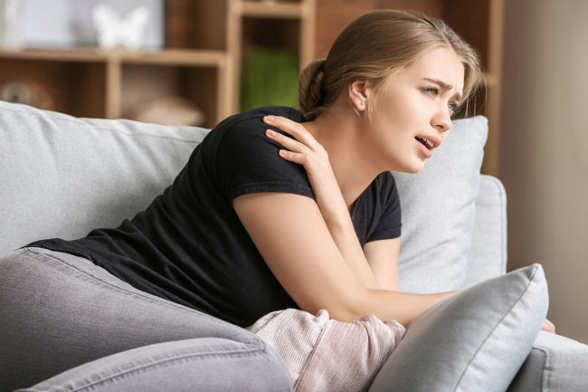 a woman showing signs of a panic attack